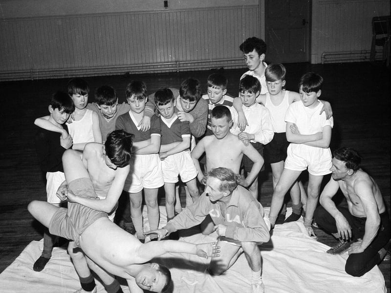 Craigentinny school boys receive wrestling tuition from John Bews in February 1964.