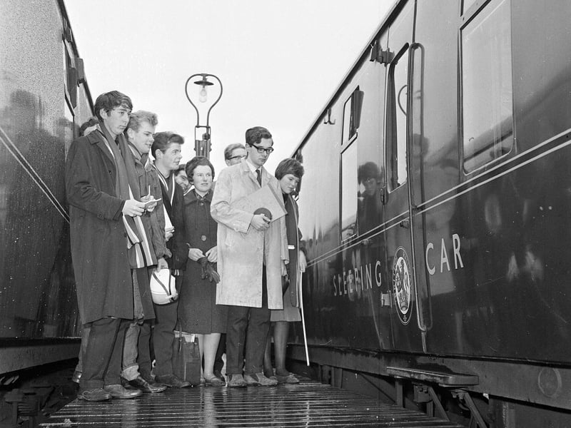 Lyn Pulford and Ian Richards measure a British Railways sleeper compartment at Craigentinny marshalling yard in December 1964.