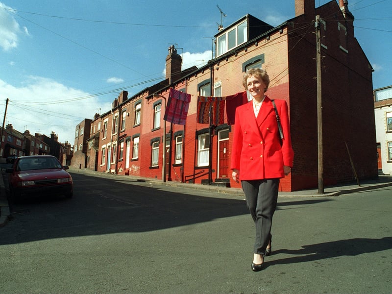 Campaigner June Hancock walks through the streets close to the former  J. W. Roberts asbestos factory in April 1996 after receiving news of her court victory. 