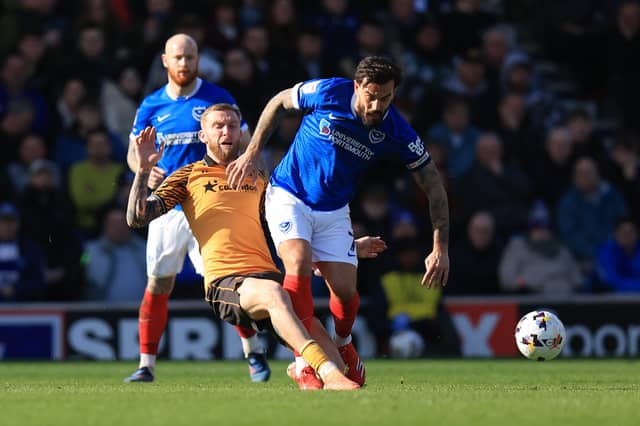 Oli McBurnie challenges Marlon Pack in Pompey's 1-0 defeat against Hull. Picture: Simon Roe/ProSportsImages