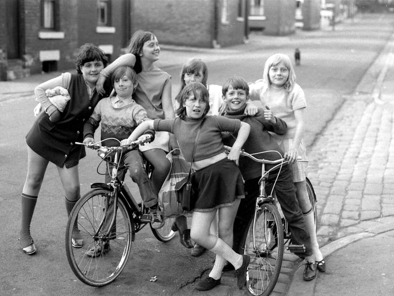 This group of girls and boys, with their bicycles, are posing for the camera with attitude. They are believed to have just returned from Kirkstall swimming baths on Kirkstall Road, which was close by. The location is believed to be Wolseley Road between Amy Street, far left, and Minnie Street before the junction with St. Matthias Place.