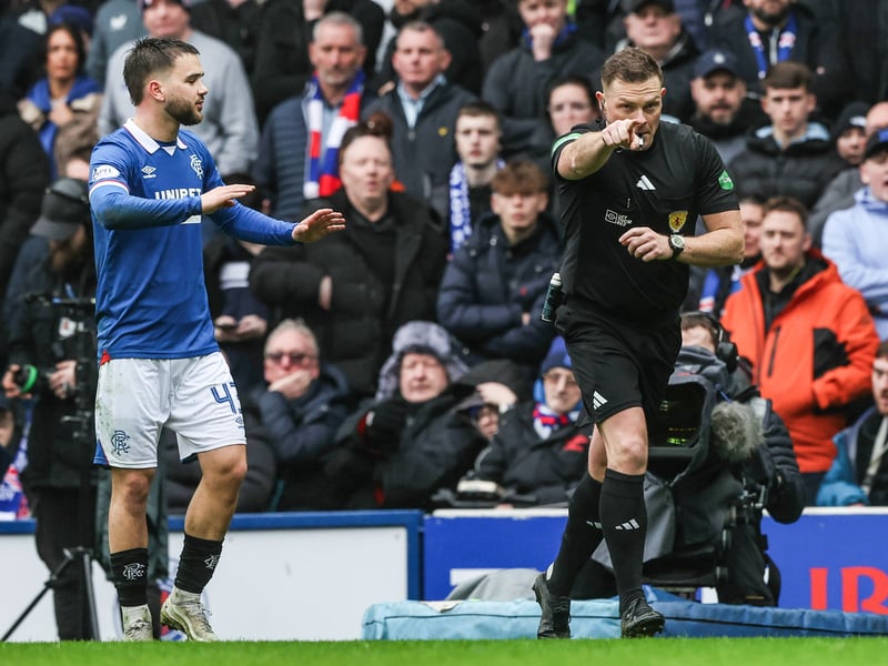 Rangers fans watch on as John Beaton awards Celtic a last minute penalty following a VAR intervention.