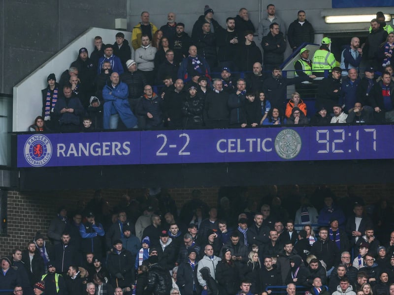 Rangers fans look on in disappointment after seeing their 2-0 goal lead disappear at Ibrox.