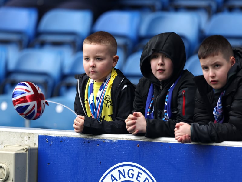 Young Rangers fans watch the warm up prior to the game at Ibrox.