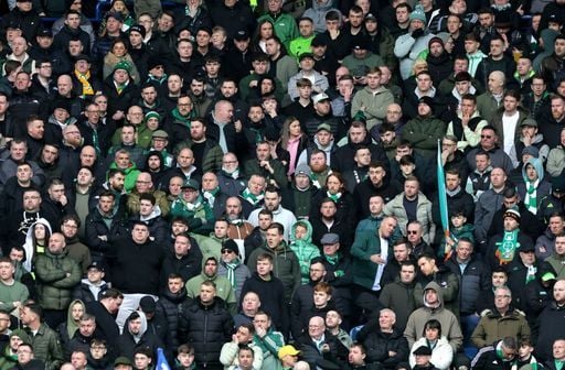 Celtic fans watch on during the first half of the Scottish Premiership clash at Ibrox.