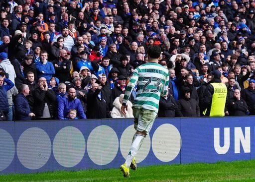 Rangers fans look on as Celtic's Sebastian Tounekti celebrates after his team mate Reo Hatate (not pictured) scored Celtic's late equaliser.