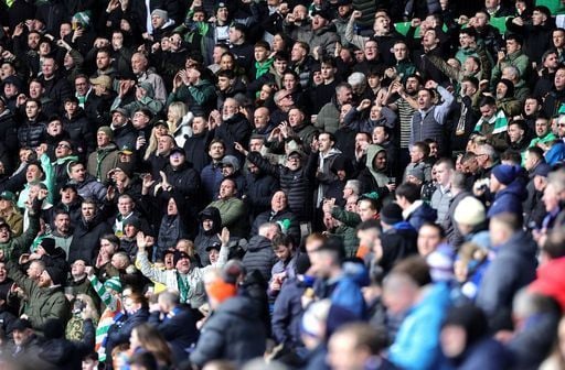 Rangers and Celtic fans in the stands get ready for the game to kick-off.