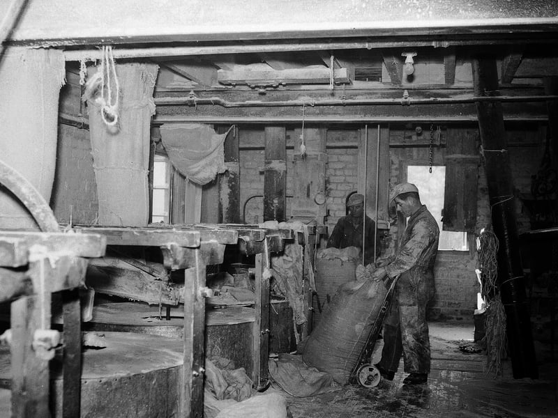 Two men at work in Redhall Mill, near Colinton, in March 1956.