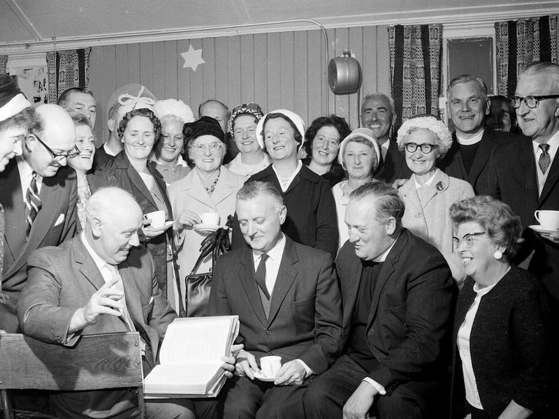 The Minister of Colinton Mains Church and congregation study the presentation hymnal in September 1964.