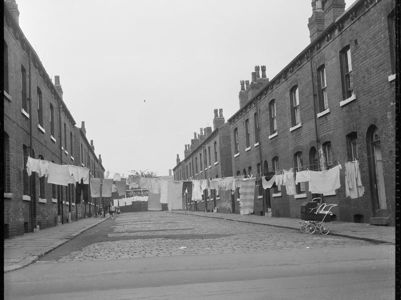 Washing hanging between back-to-back houses in Burmantofts, Leeds, during the late 60s or early 70s