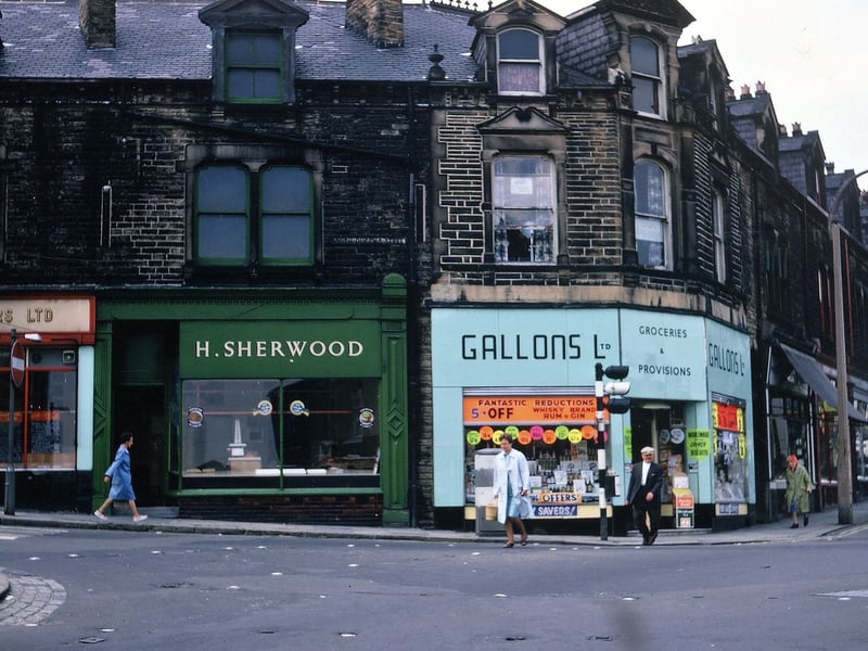 The parade of shops at the corner of South Queen Street and Fountain Street in July 1967. The shops shown are Wallace Arnold Tours, H. Sherwood (butcher) and Gallons Ltd (groceries and provisions) on South Queen Street, and Green's (pork butchers) round the corner on Fountain Street.
