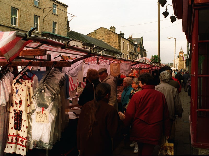 Otley market stalls crowd close to the shops in Kirkgate in January 1997. 