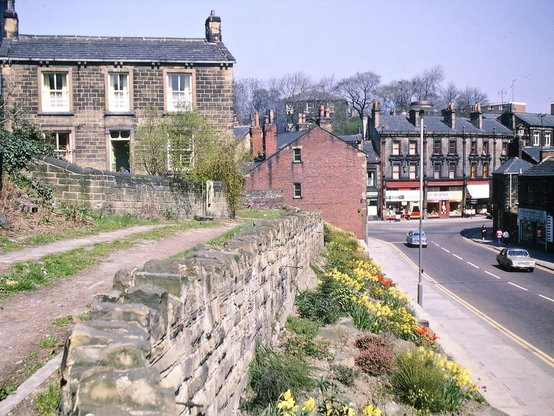 The front of Dawson House (and rag warehouse behind) on Dawson Hill after the removal of the buildings on the roadside for widening in the Scatcherd Hill part of Morley Bottoms. Pictured in May 1967.