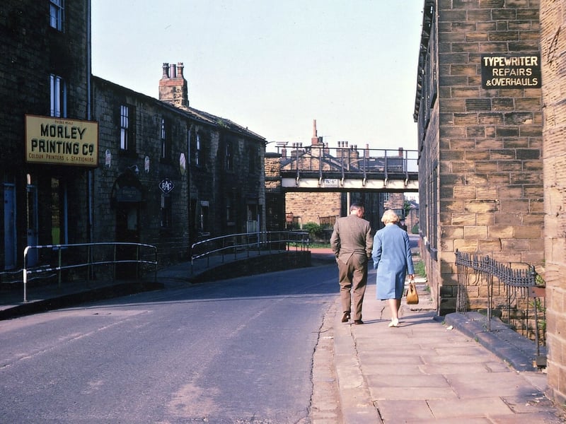 High Street looking towards the railway bridge which, while appearing decrepit and derelict, was still taking the occasional freight train into Morley Top Station. Pictured in May 1967.