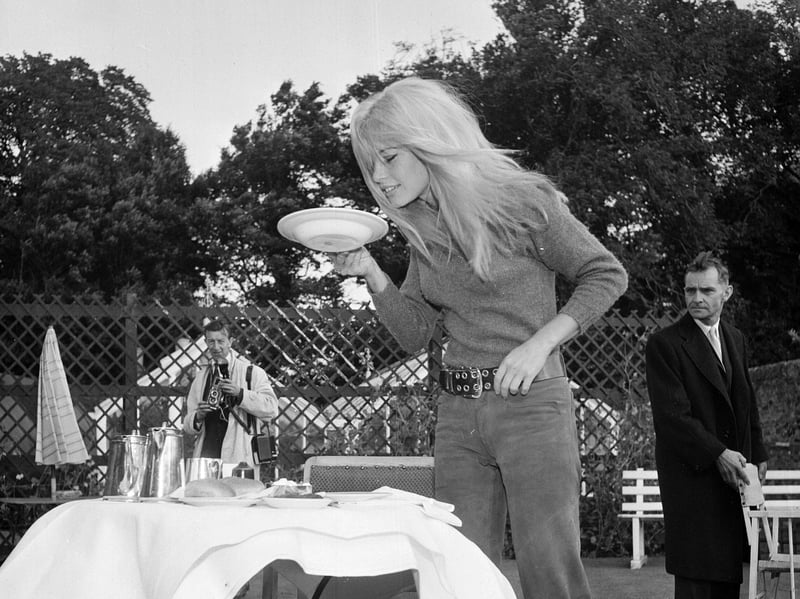 Brigitte Bardot at Dirleton, where she was filming scenes for the film A Coeur Joie (Two Weeks in September) with Laurent Terzieff in September 1966. She is seen looking very carefully at a bowl of porridge.