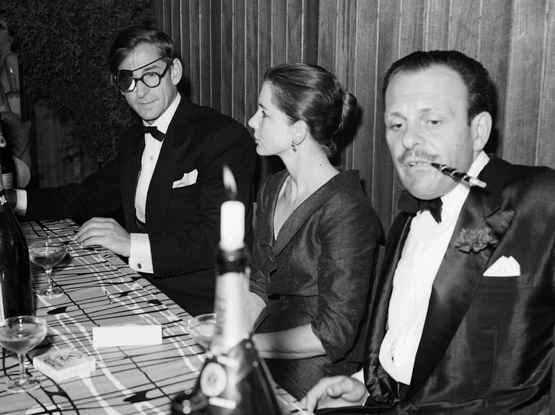 Terry-Thomas with director John Boulting and his wife Anne, at the White Cockade Club, Edinburgh, after the premiere of the film Lucky Jim in 1957
