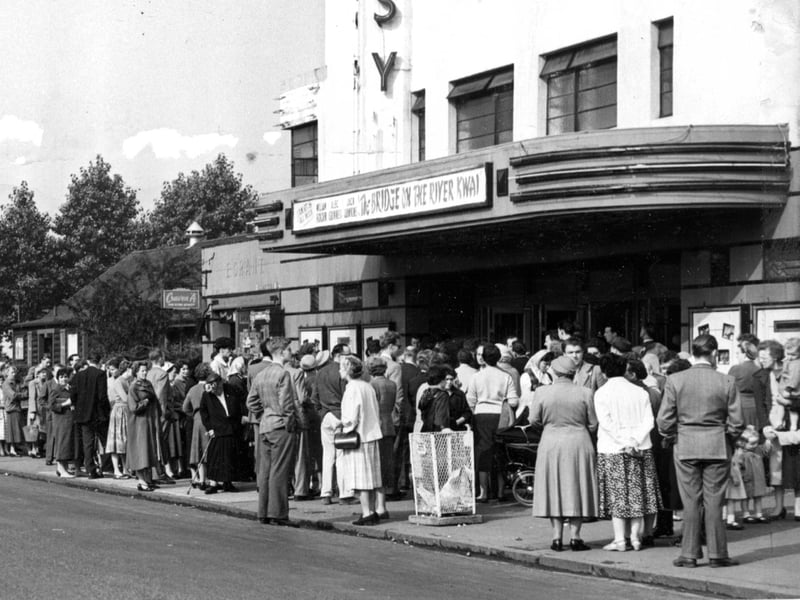 A huge crowd of people outside the Embassy Cinema, Pilton, during the 1958 Edinburgh Festival as they try to get into the 'bob-a-head' concert given by three of the world's greatest musicians, violinist Yehudi Menuhin, cellist Gaspar Cassado and pianist Louis Kentner