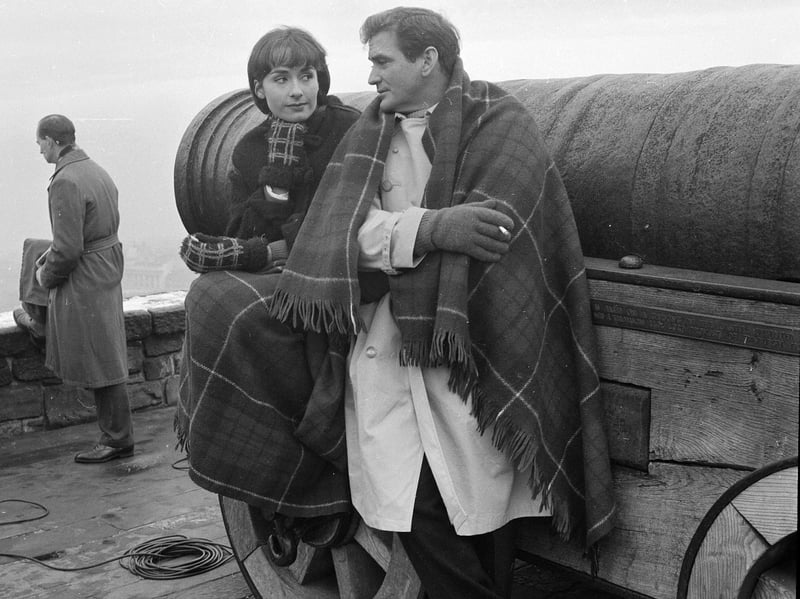 Rod Taylor and Elizabeth MacLennan have a cigarette on the battlements during a break in filming for TV show The Ordeal of Dr Shannon, at Edinburgh Castle, in 1962