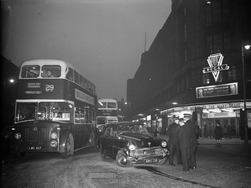 A car crash outside the ABC Regal Cinema, at the junction of Bread Street and Morrison Street, Edinburgh, in 1960. The Wreck of the Mary Deare is showing, and the number 29 bus to Frederick Street is passing by.