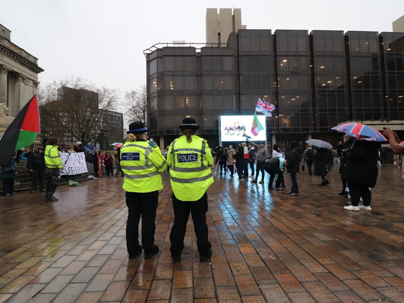 Police monitor the two sides apart at the Iran war protests in Guildhall Square in Portsmouth on Friday, March 6.