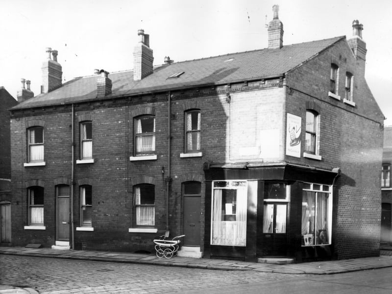 Freestone Street from the junction with Disraeli Terrace in November 1965. Number 9 is Gwendoline's ladies hairdressers and the windows are festooned with gathered net curtains. In one window there are photographs of models wearing hairstyles fashionable in the mid-sixties.