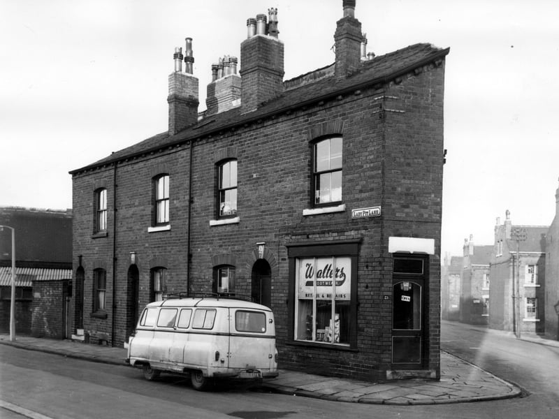 Properties on Lady Pit Lane at the junction with Northcote Road in November 1965. Number 23 is a shoeshop, Walters Footwear, retail and repairs, and number 21 is part of the same property. For many years, from the early 1900s to the late 1940s it had been a hairdressers. On the far left, part of the old Lady Pit Lane Wesleyan Chapel can be seen, now Progress Works.