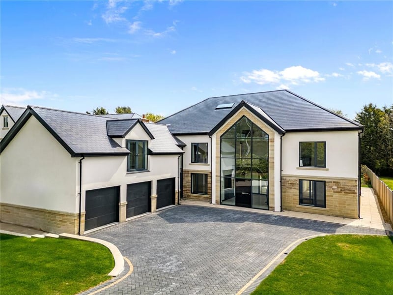 A substantial six-bedroom luxury home offering close to 7,000 sq ft of accommodation, including five reception rooms and seven bathrooms. The property combines grand proportions with modern finishes, along with a triple garage and landscaped grounds.