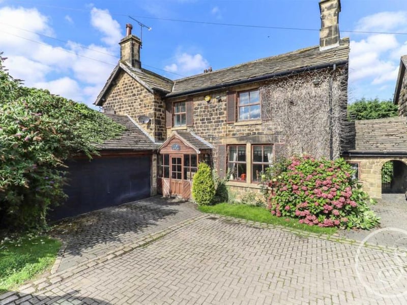 A four-bedroom detached stone house set within a small gated development just off Wigton Lane, offering around 2,500 sq ft of living space and mature gardens. The property includes two reception rooms, a kitchen-diner and double garage, with scope for modernisation.