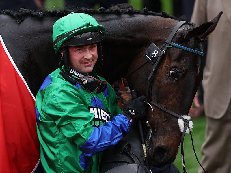 Jockey Nico de Boinville celebrates with racehorse Old Park Star after winning the Supreme Novices' Hurdle.