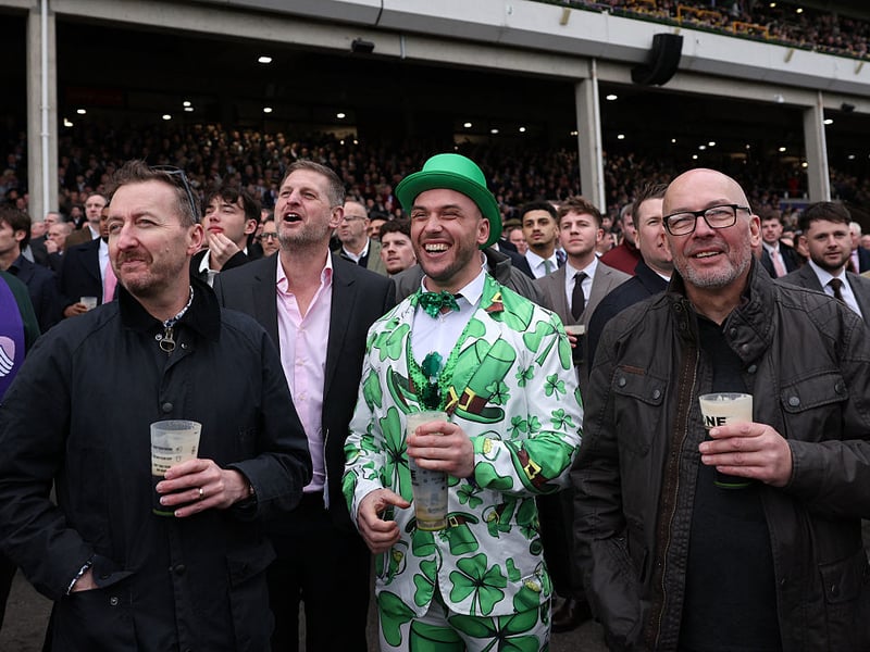 Racegoers watch the McCoy Contractors Juvenile Handicap Hurdle horse race.