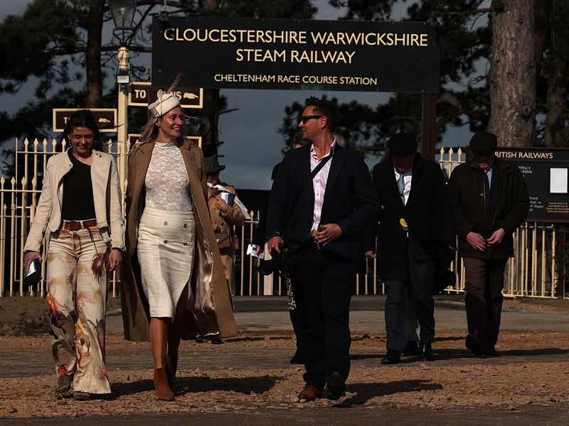Racegoers alight from the steam train on Champion Day during day one of the Cheltenham Festival.