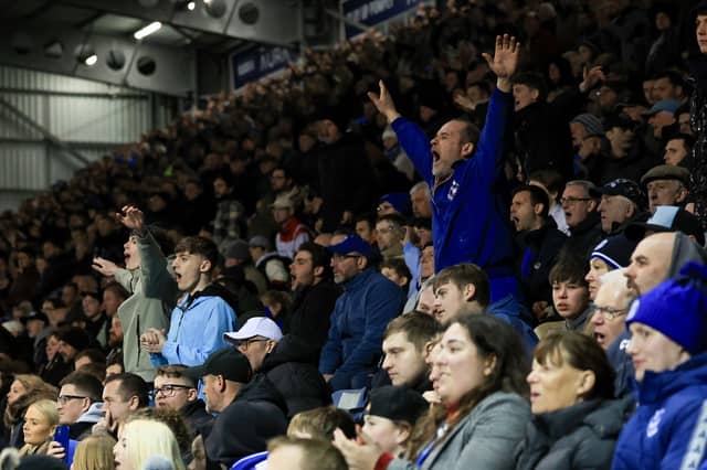 Brilliant pictures of Pompey fans backing Blues under Fratton lights against Swansea City.