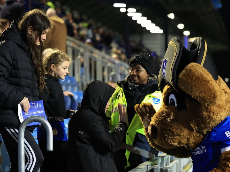 Brilliant pictures of Pompey fans backing Blues under Fratton lights against Swansea City.