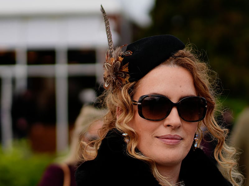 A racegoer in shades enjoying Ladies Day.