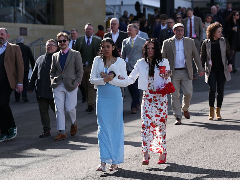 Racegoers arrive at Cheltenham Race Course for Ladies Day.