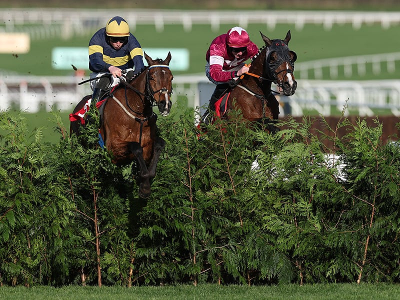 Conor Stone-Walsh riding Final Orders and Jack Kennedy riding Favori De Champdou jump the last fence in the Glenfarclas Cross Country Chase on Ladies Day.
