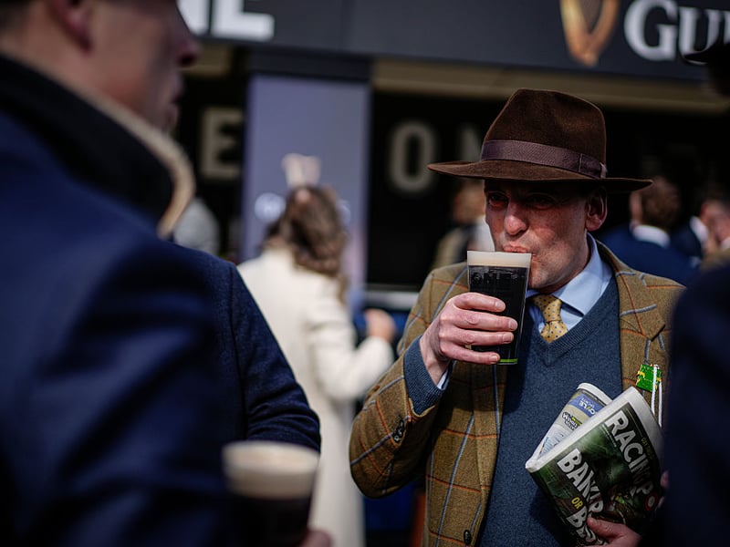 Enjoying the black stuff during Ladies Day.