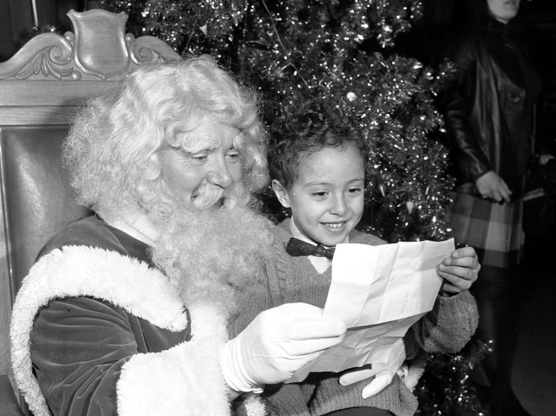 A young boy meets Santa at Jenners department store, on Princes Street, Edinburgh, in 1969