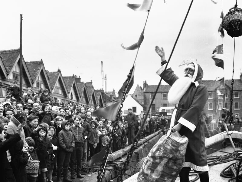 Santa arrives by boat at Newhaven Harbour, Edinburgh, in 1969