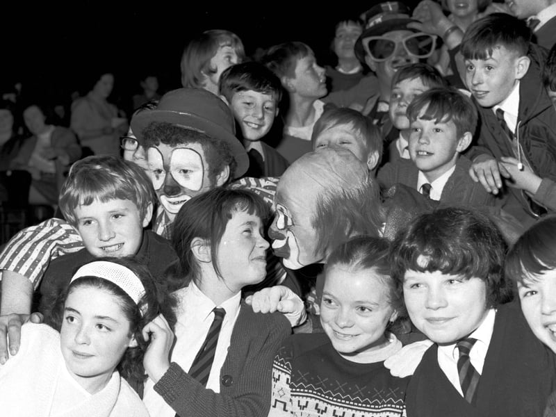 Youngsters in the audience get a kiss from Brum the clown at the Kelvin Hall circus in December 1968