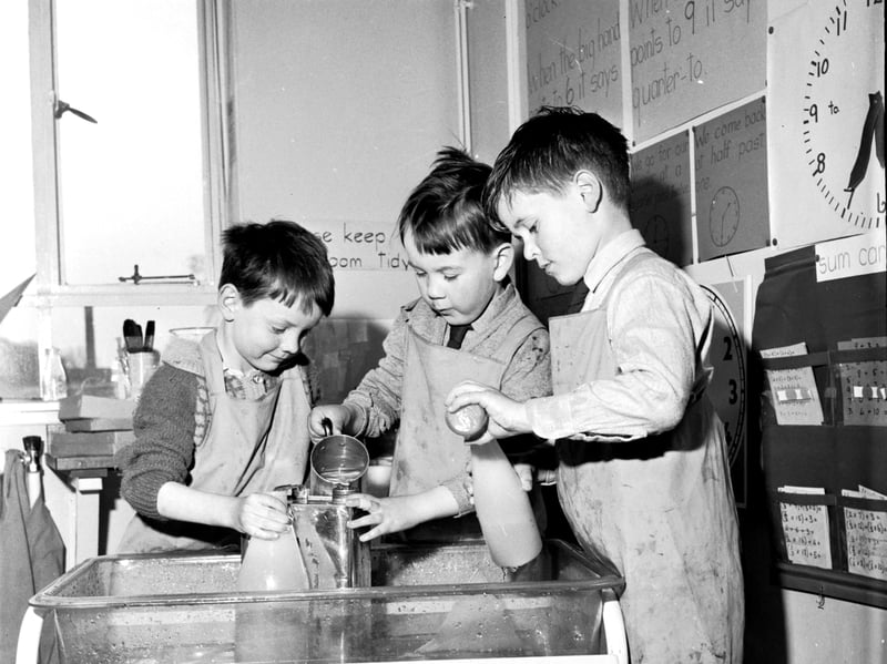 Primary school children work on their measuring skills using water, jugs and bottles at an unidentified Glasgow school in April 1966