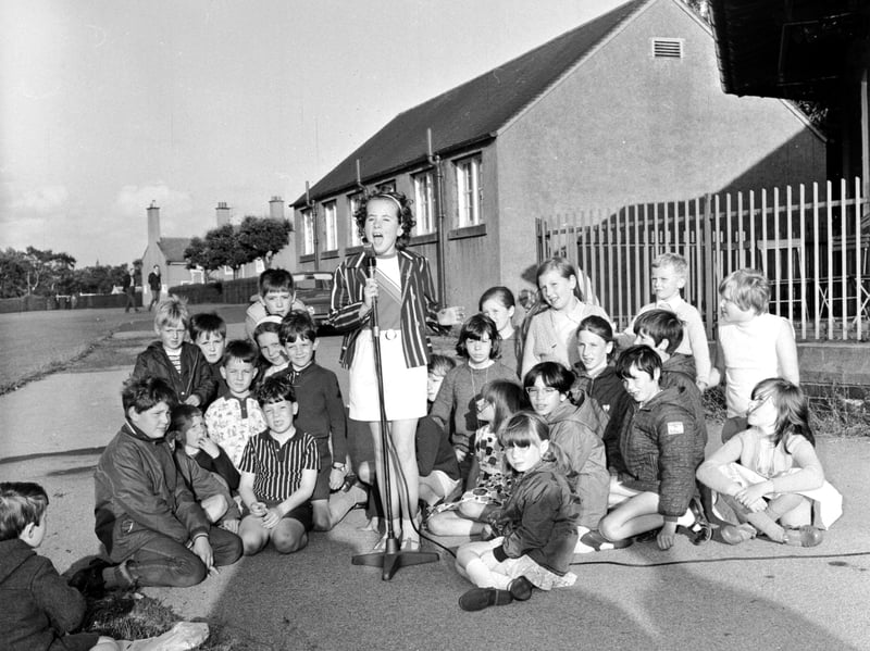 A girl sings at a talent contest in Inverleith Park, Edinburgh, in 1969