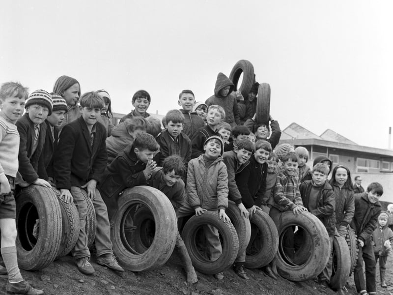Children playing with tyres at an adventure playground in Livingston, West Lothian, in April 1969