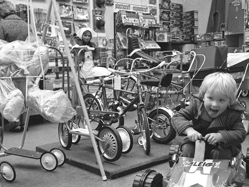 A youngster is pictured here in a toy shop in 1976, which was a golden year for toys. That was when slime was first sold, to the delight of youngsters and the horror of their parents. It was also the year the first 'Eagle Eyes' Action Man figures, with swivelling eyes, were released, and other popular toys included Lite Brite and Magna Doodle.