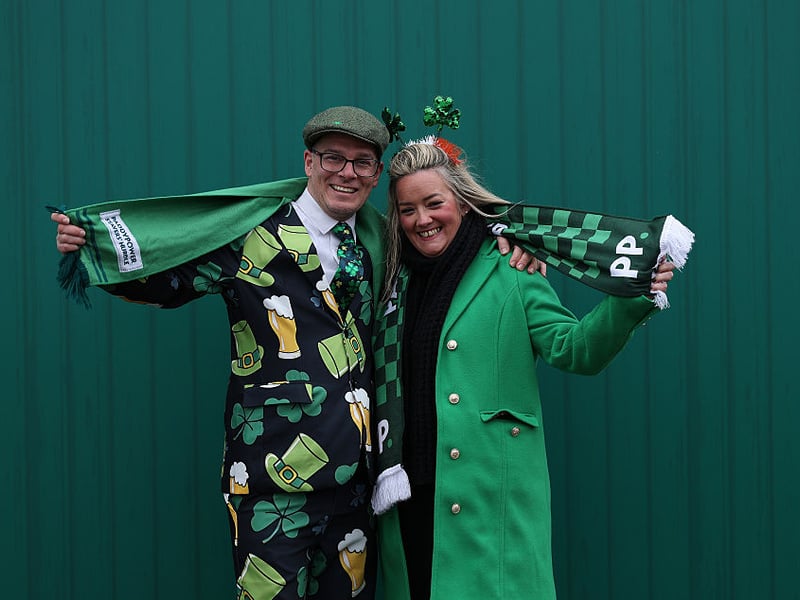 Racegoers poses for a photo dressed for St Patrick's Thursday.