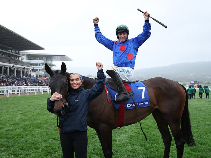 Jack Kennedy celebrates after riding Wodhooh to victory in the Close Brothers Mares' Hurdle.