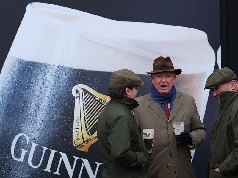Racegoers enjoy a chat on St Patrick's Day at Cheltenham.