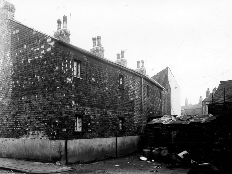 This area is the rear view of numbers 2, 4 Burley Grove, looking from the end of Bracewell Grove. To the right, not in view is the back of Ventnor Street Methodist Chapel and School room. Pictured in December 1959.
