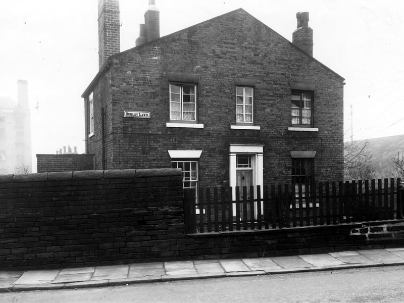 Burley Road number 241, house called Burley Lawn. In the background part of the old Willow Brewery can be seen. To the right the embankment for the Leeds - Harrogate railway line. Pictured in December 1959.
