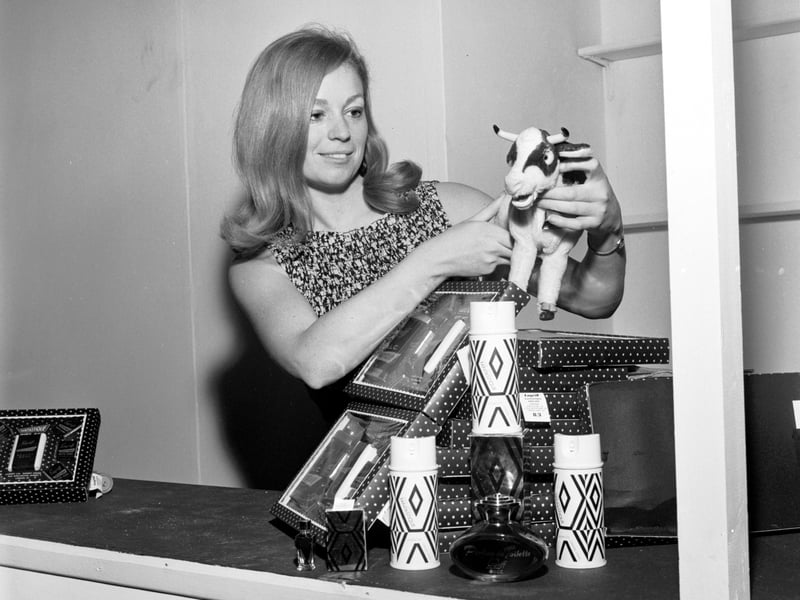 Miss Susan Wood prepares Lagriff Ltd's cosmetics stand at the Ideal Home Exhibition in Waverley Market in April 1966.